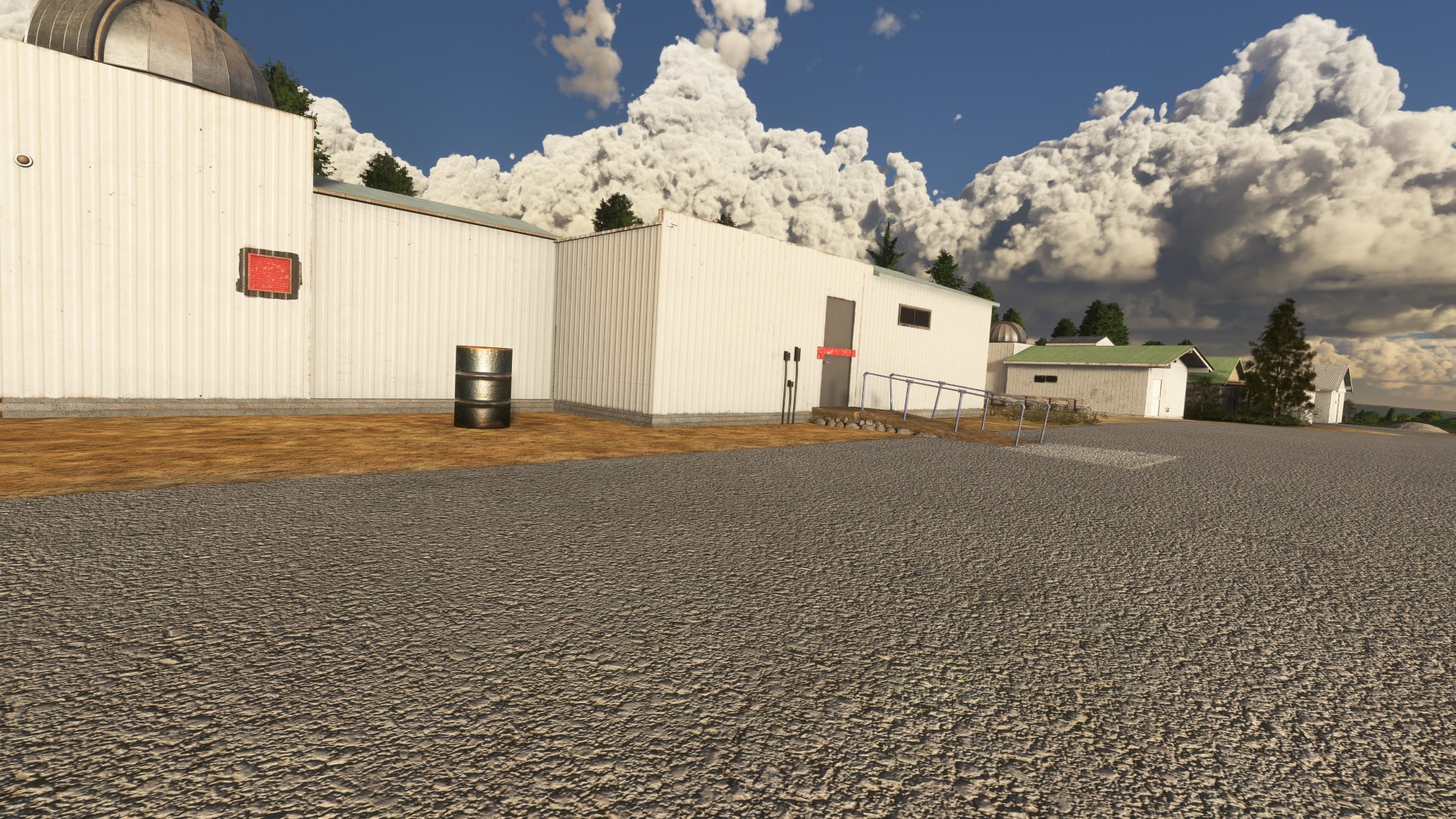 Close up photo of an observatory with towering clouds in the background at KBLU Blue Canyon Nyack in MSFS