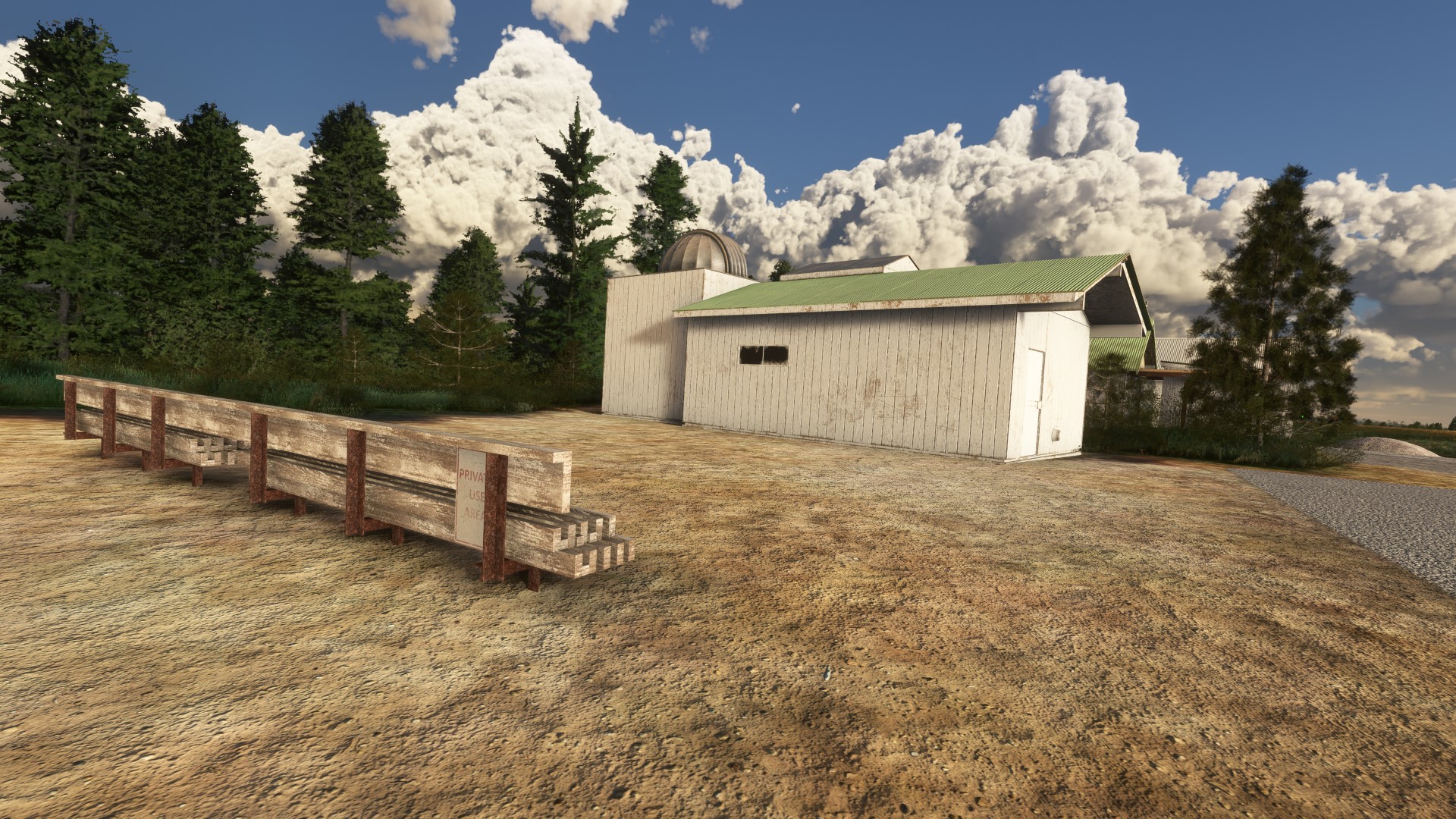 Photo of a 2nd observatory with white wooden walls and a nearby stack of lumber at KBLU Blue Canyon Nyack in MSFS